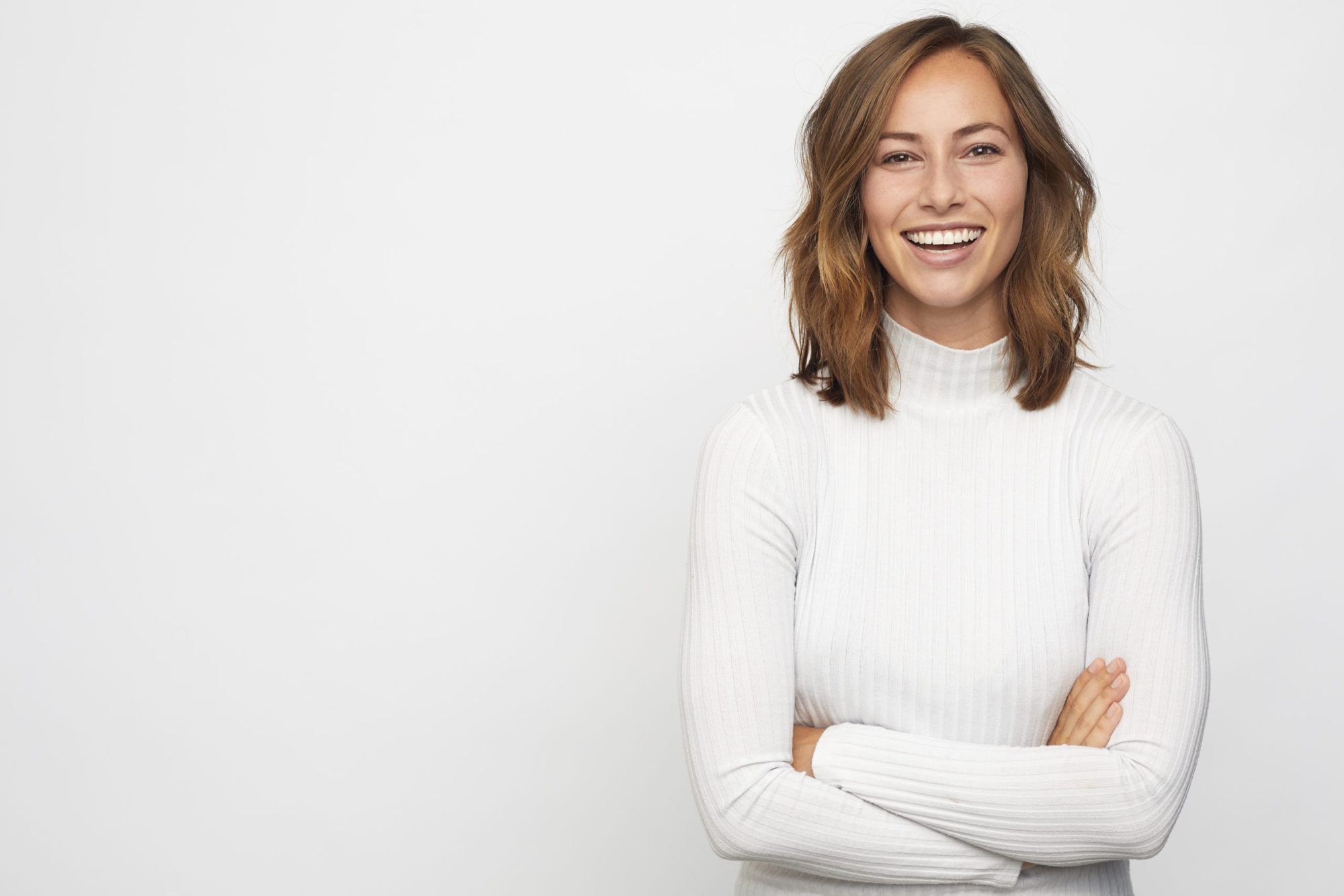 portrait of young happy woman looks in camera portrait of young happy woman looks in camera