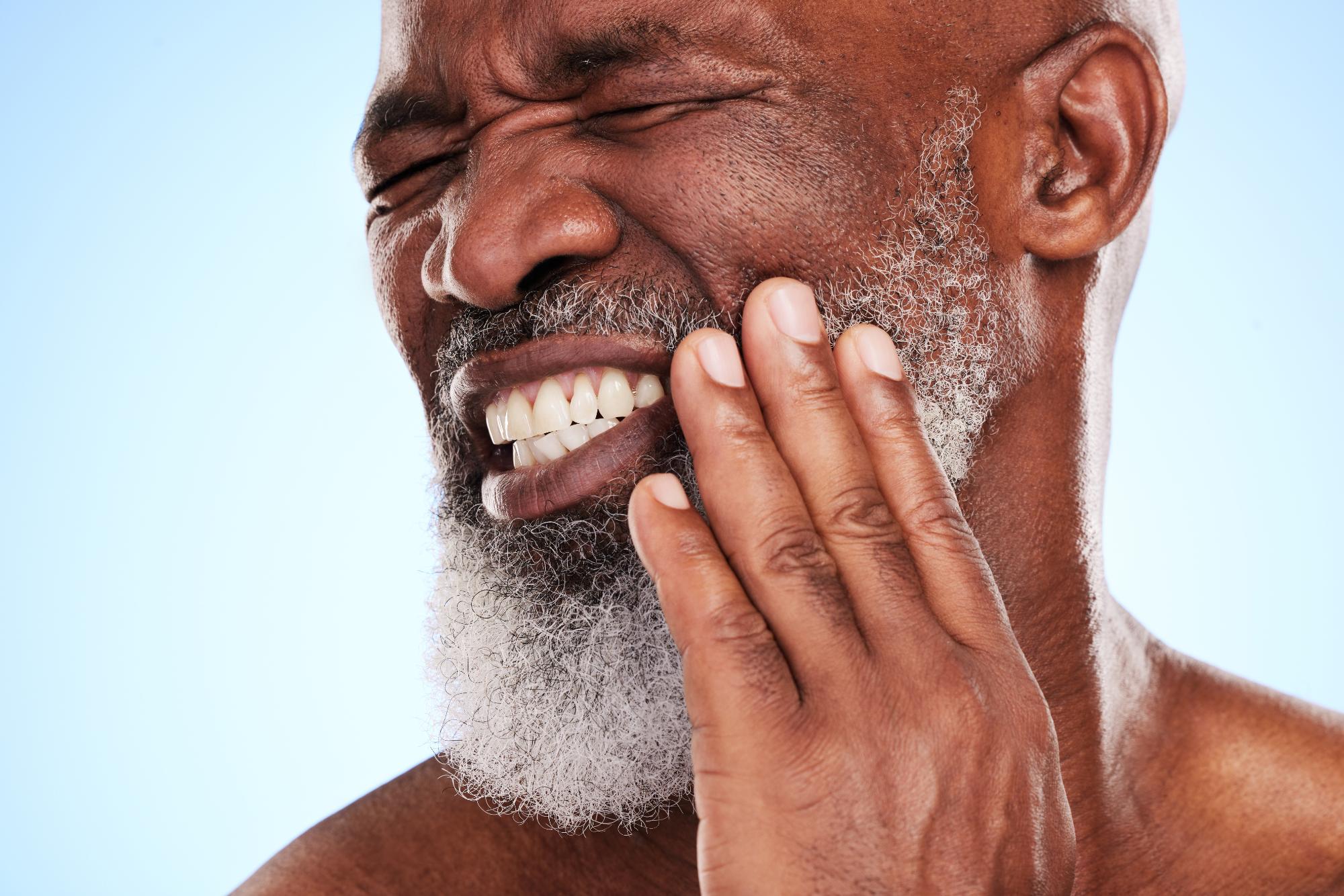 cropped-shot-of-a-handsome-mature-man-posing-in-st-2023-11-27-05-34-53-utc Craniofacial Pain & Headaches